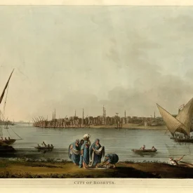 Ilustração antiga do Rio Nilo, com um grupo de mulheres em primeiro plano, pescadores e barcos à vela em segundo plano, a cidade de Rosetta com arquitetura otomana e minaretes ao fundo.